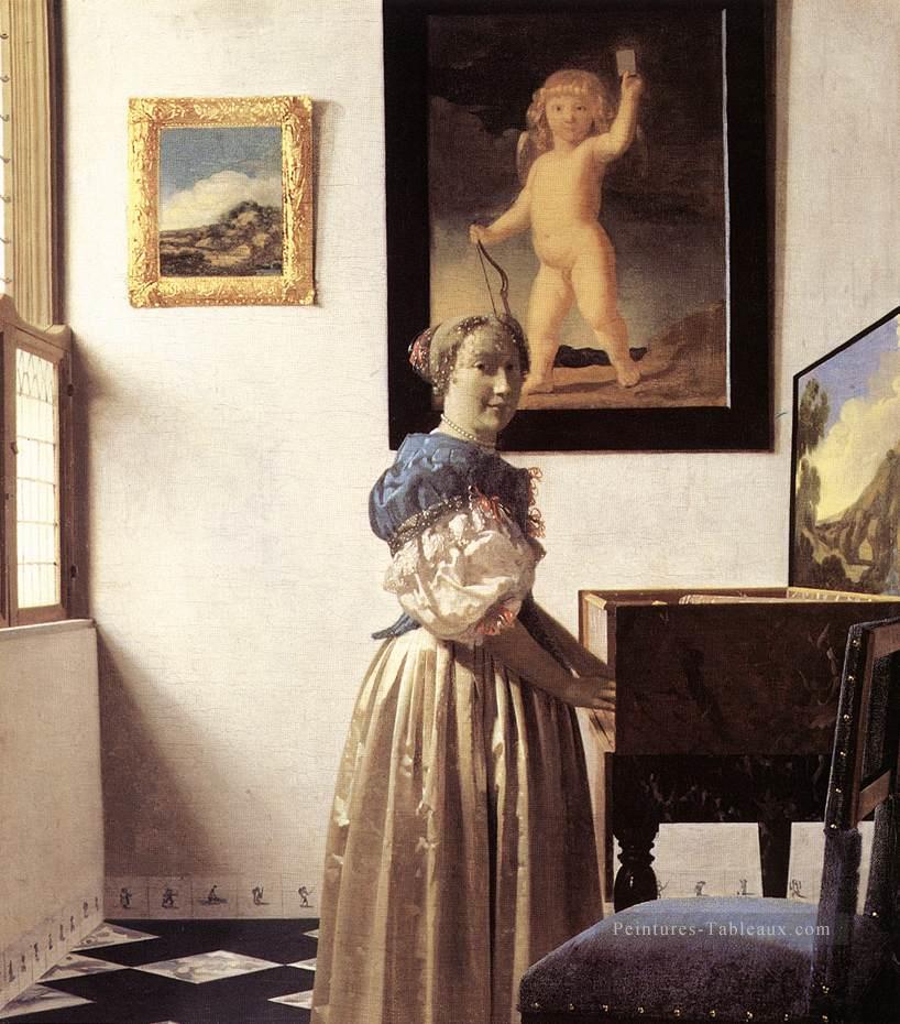 Dame debout dans un baroque virginal Johannes Vermeer Peintures à l'huile